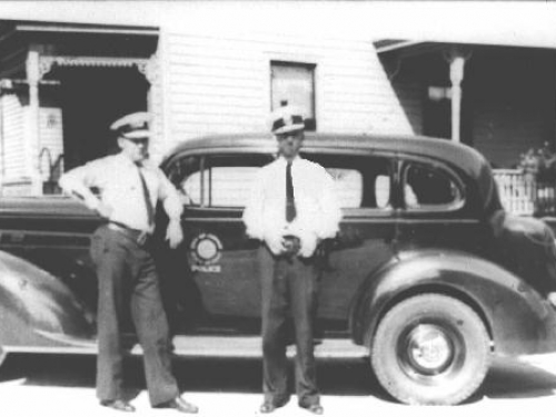 Stein and Lustenburg next to a 1936 Packard